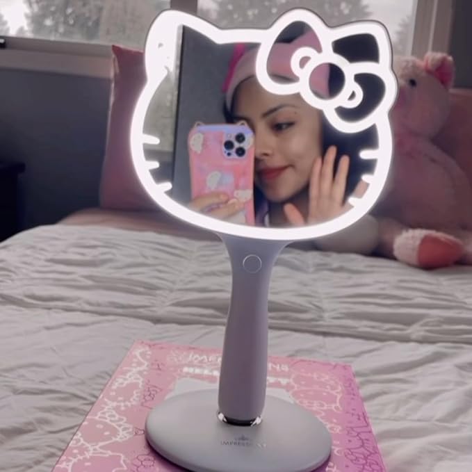Impressions Vanity Hello Kitty LED Handheld Mirror, Makeup Vanity Mirror with Standing Base and Adjustable Brightness