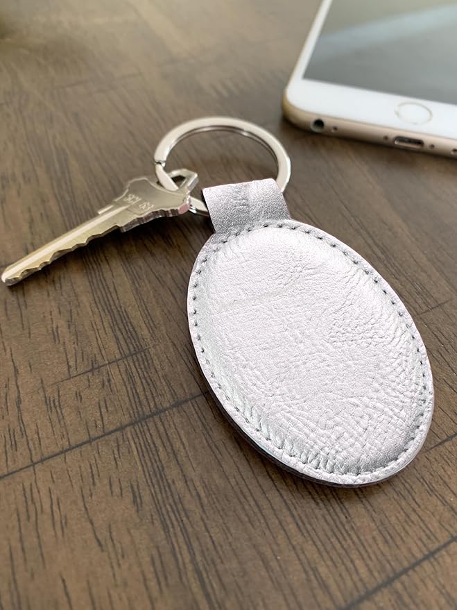LaserGram Oval Keychain, Golfer Golfing, Personalized Engraving Included (Silver)