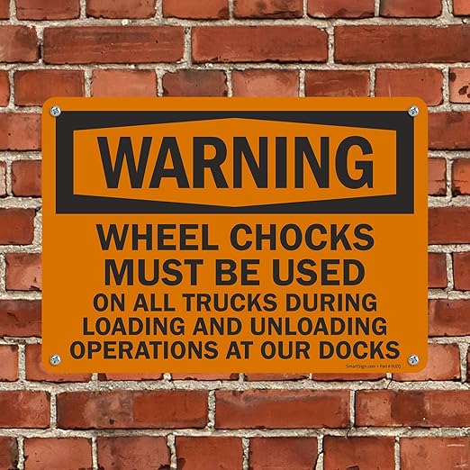 SmartSign "Warning - Wheel Chocks Must Be Used On All Trucks During Loading and Unloading Operations at Our Docks" Sign | 10" x 14" Plastic
