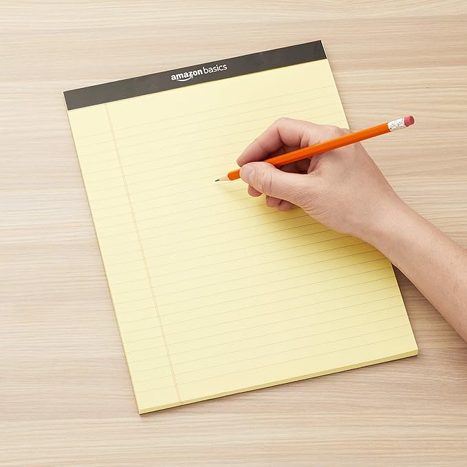 Amazon Basics Wide Ruled Lined Writing Pads, 8.5" x 11.75", Canary, 12-Pack of 50 Perforated Sheets, Sturdy Backing