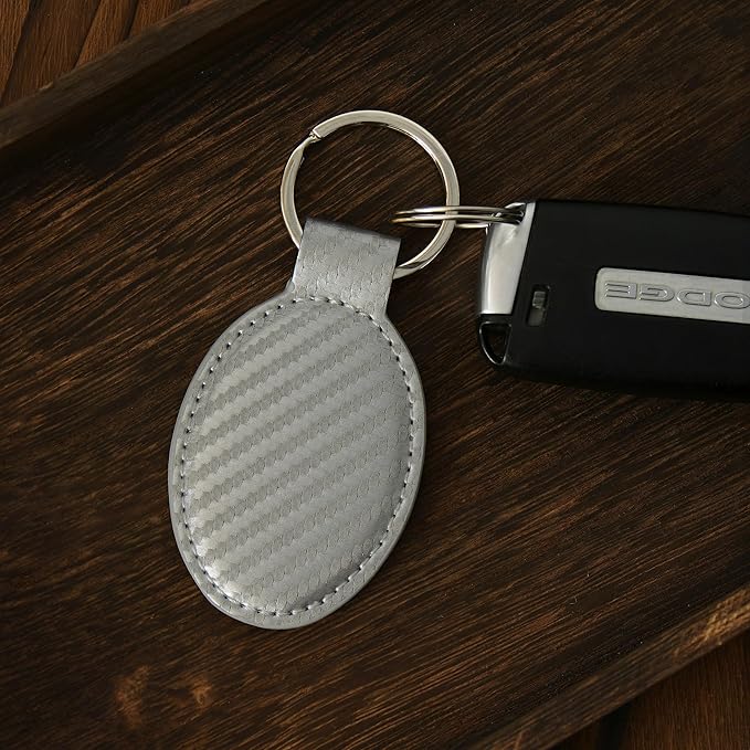 LaserGram Oval Keychain, Golfer Golfing, Personalized Engraving Included (Carbon Fiber Silver)